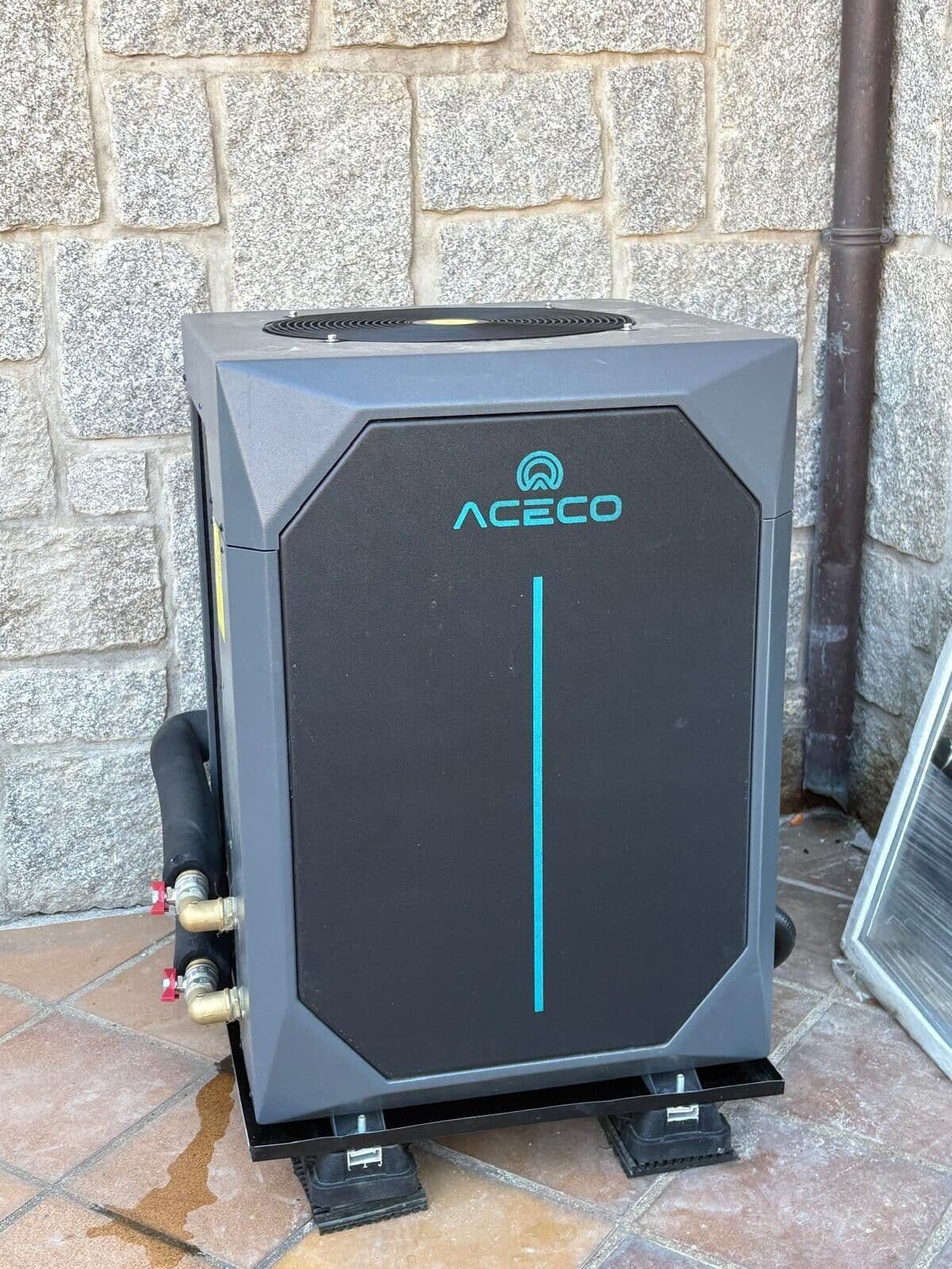 ACECO heat pump installed in front of a stone wall