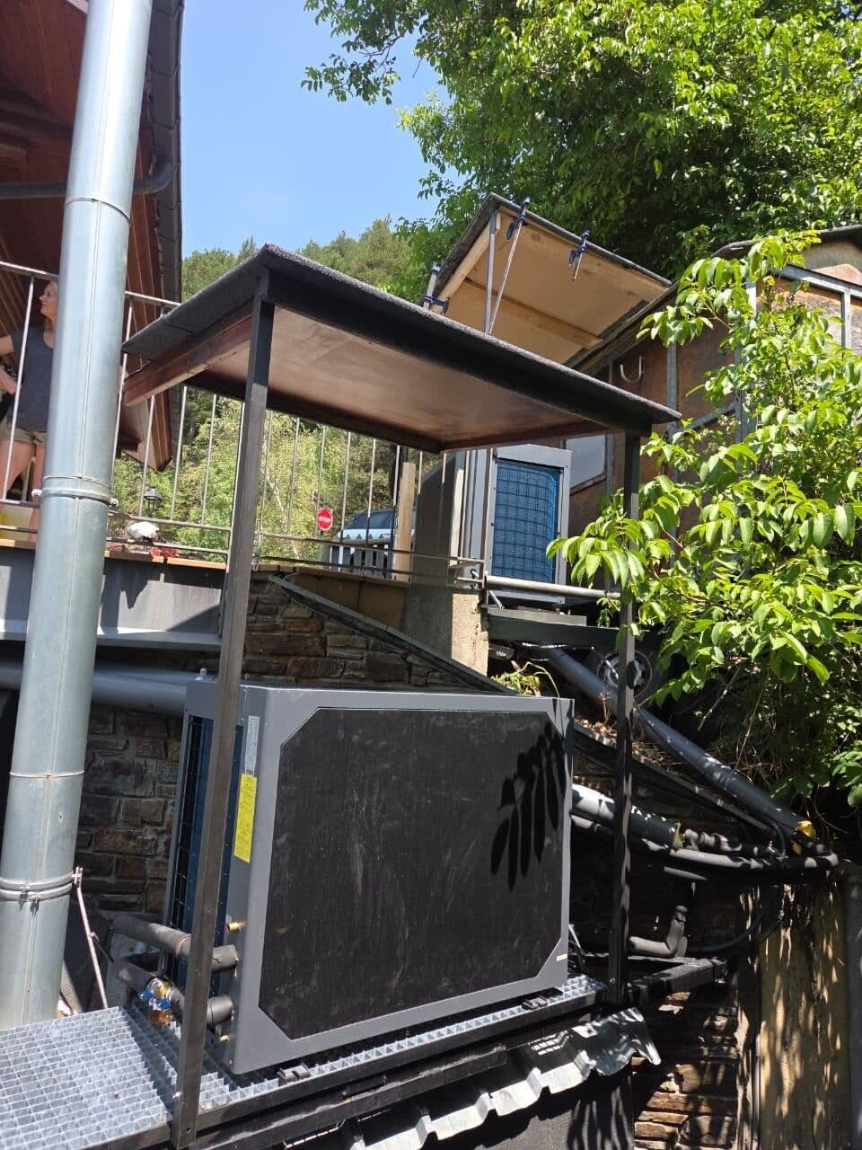 Heat pump under a pergola on a terrace